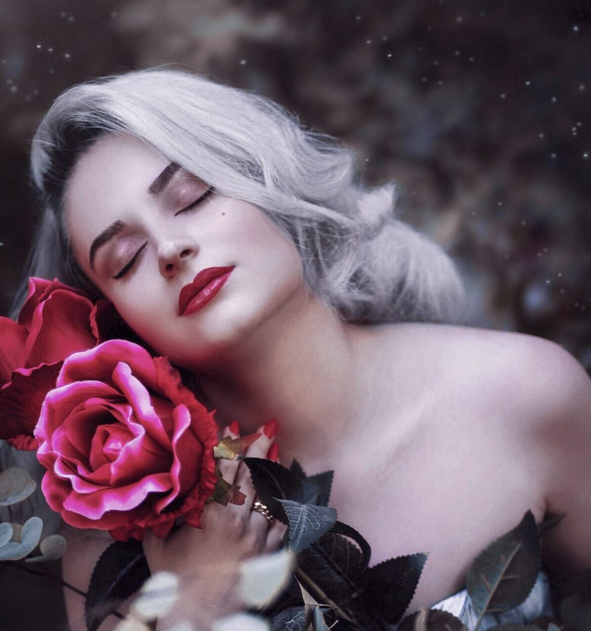 selective focus photography of woman beside rose flower