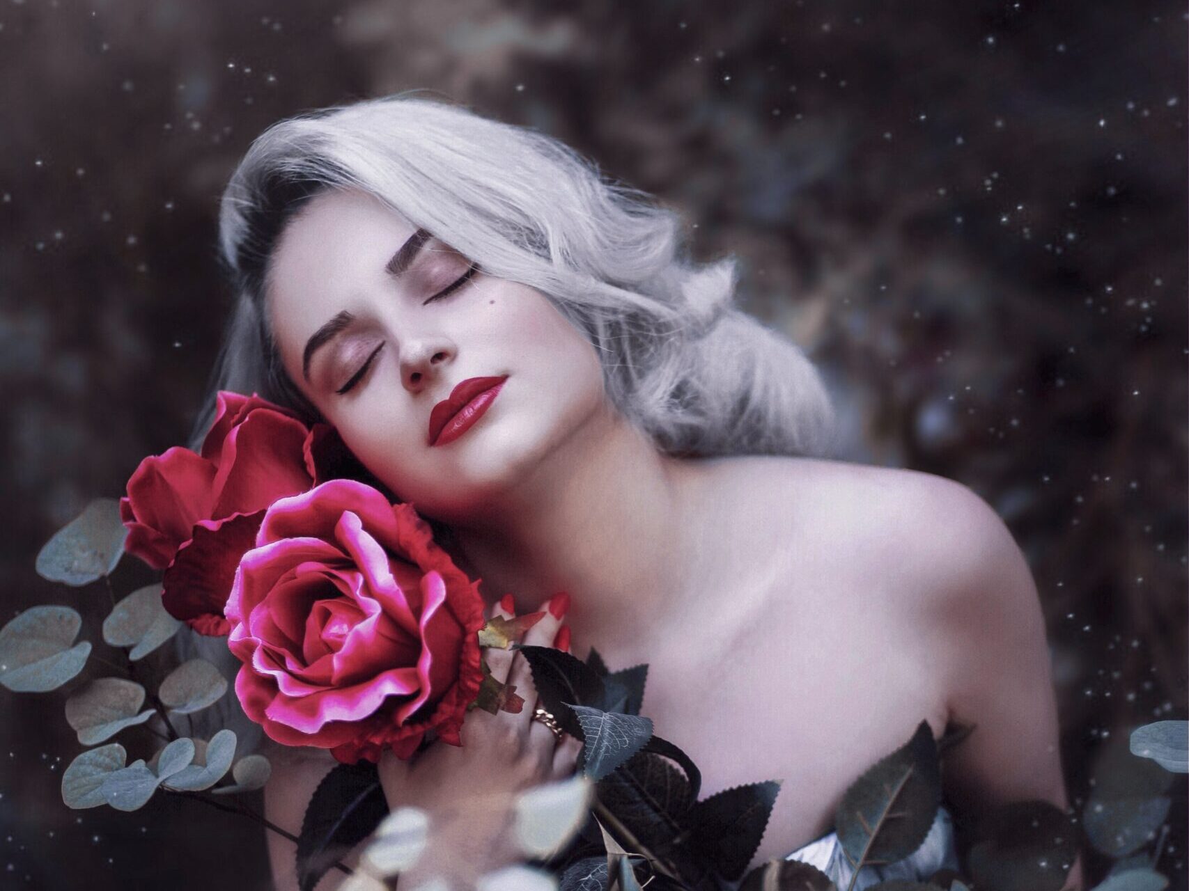 selective focus photography of woman beside rose flower