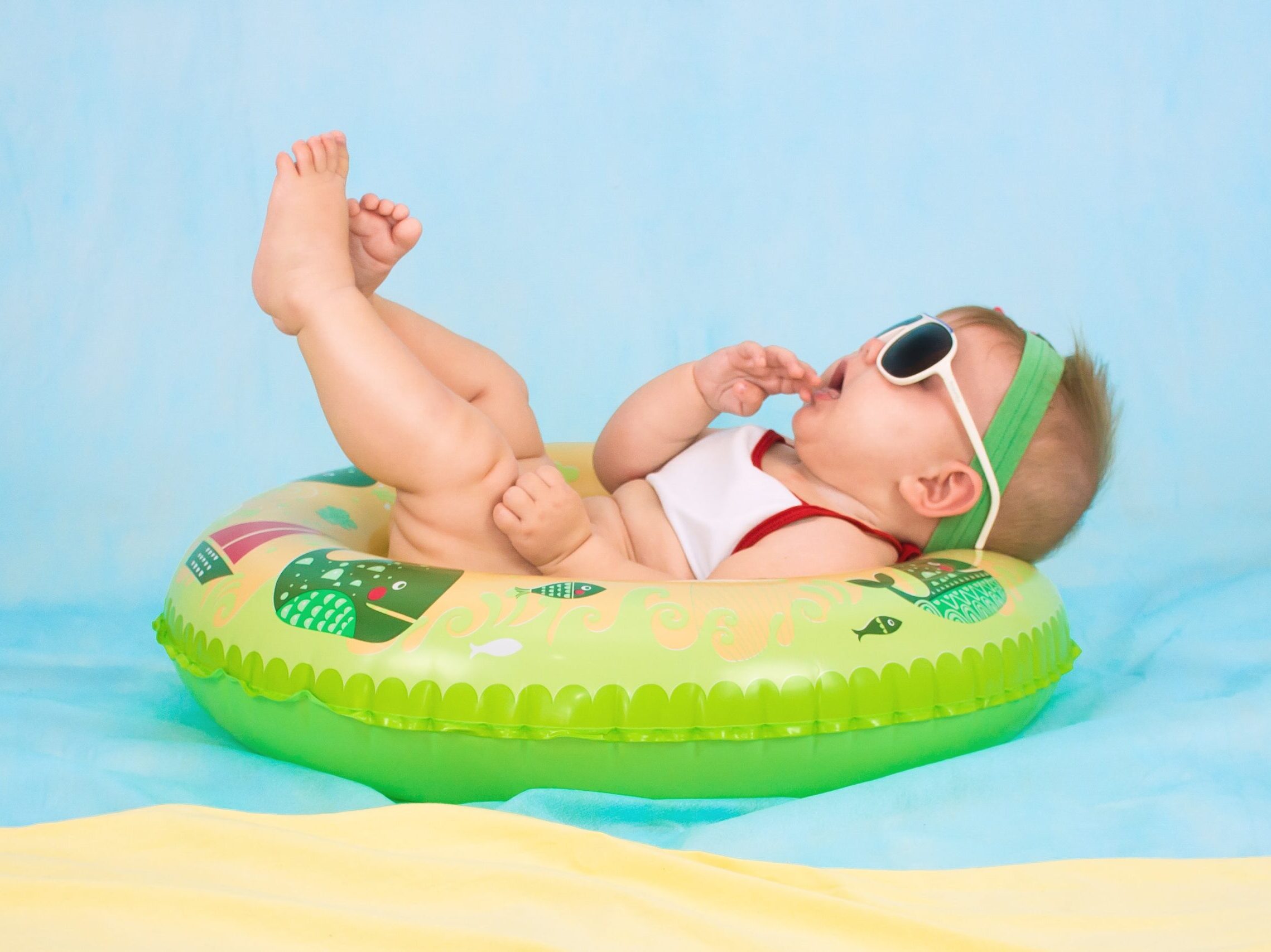 baby lying on inflatable ring