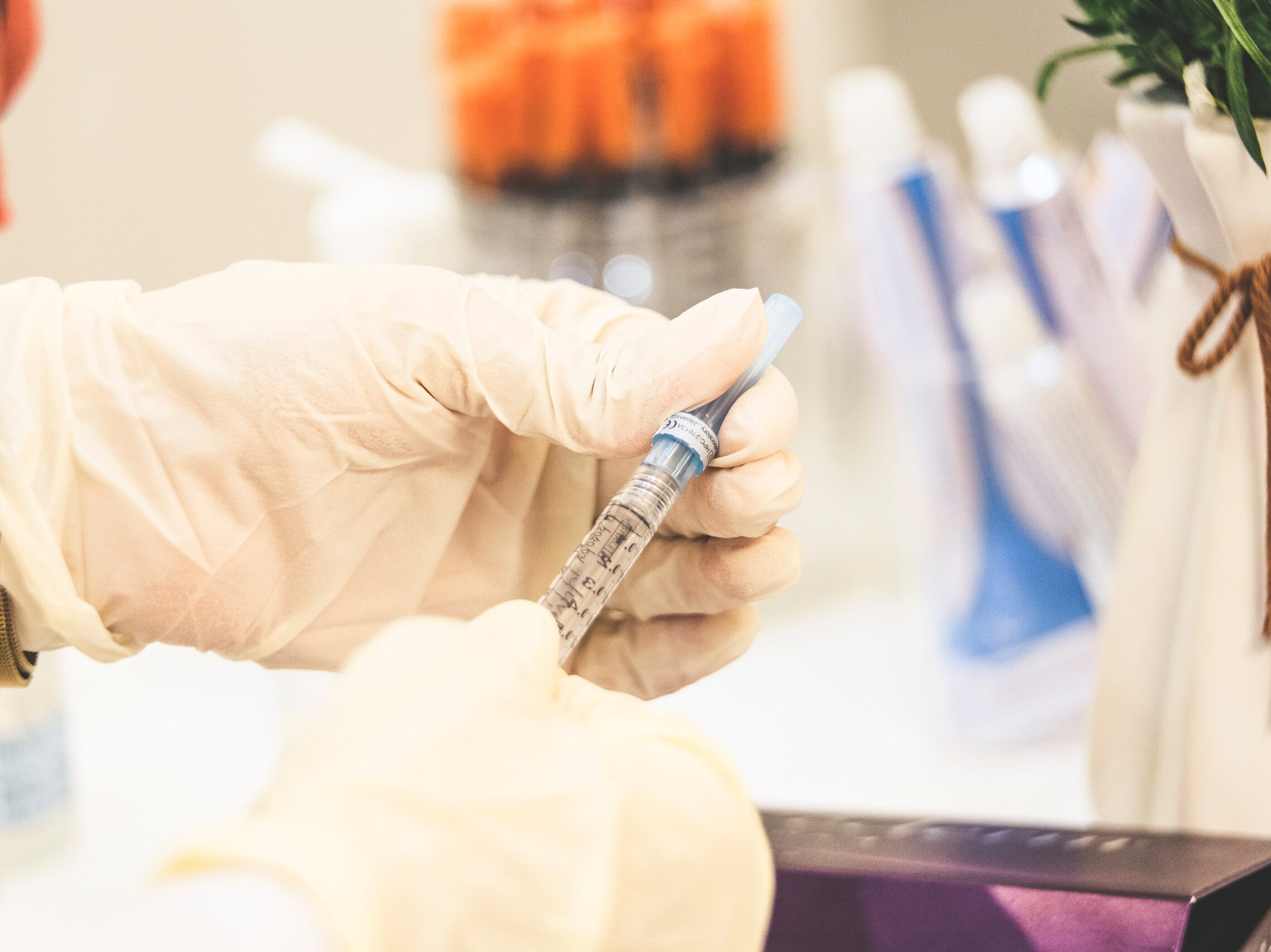 person holding white and black pen