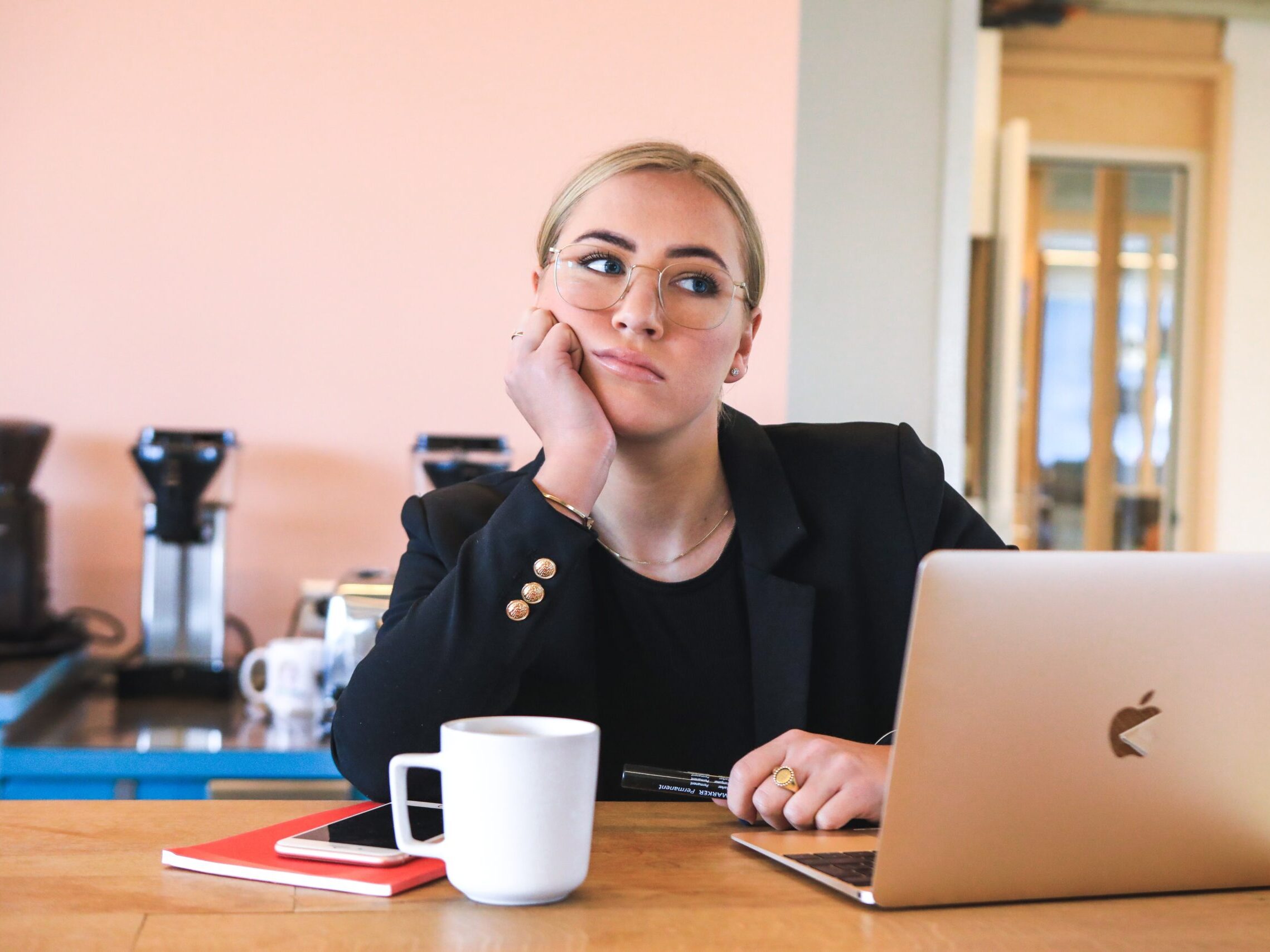 woman in black long sleeve shirt using macbook
