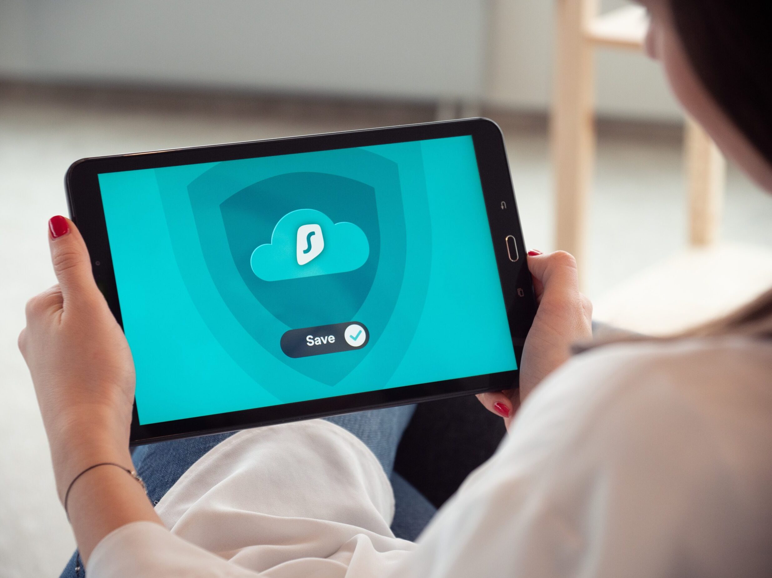 person holding black tablet computer