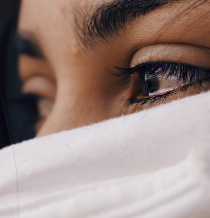 shallow focus of a woman's sad eyes