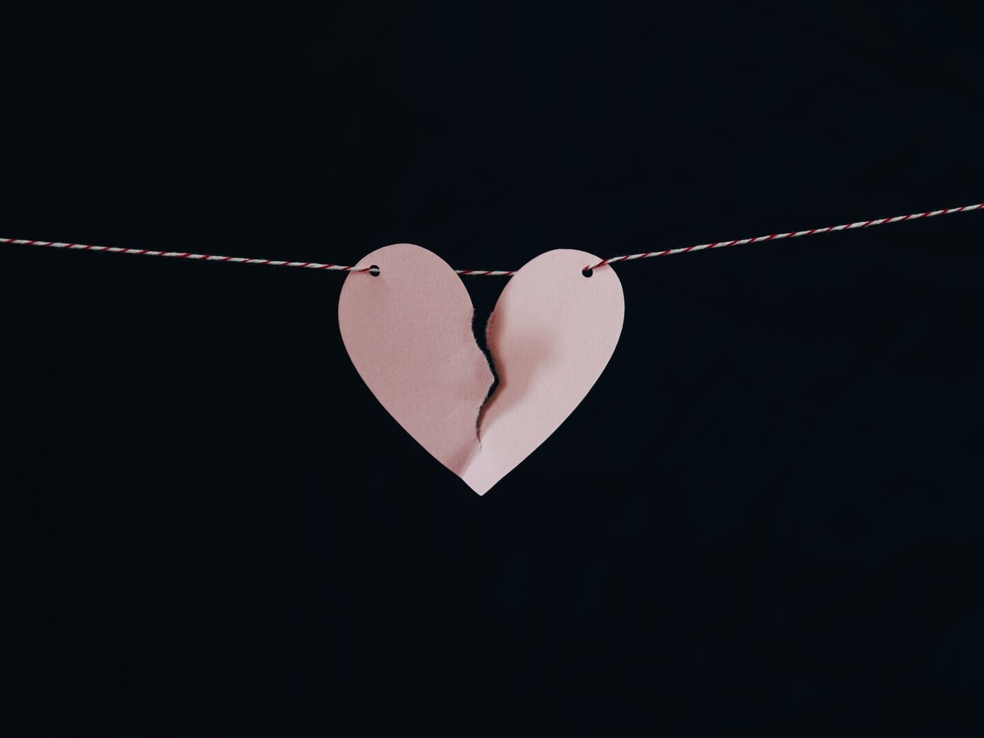 broken heart hanging on wire