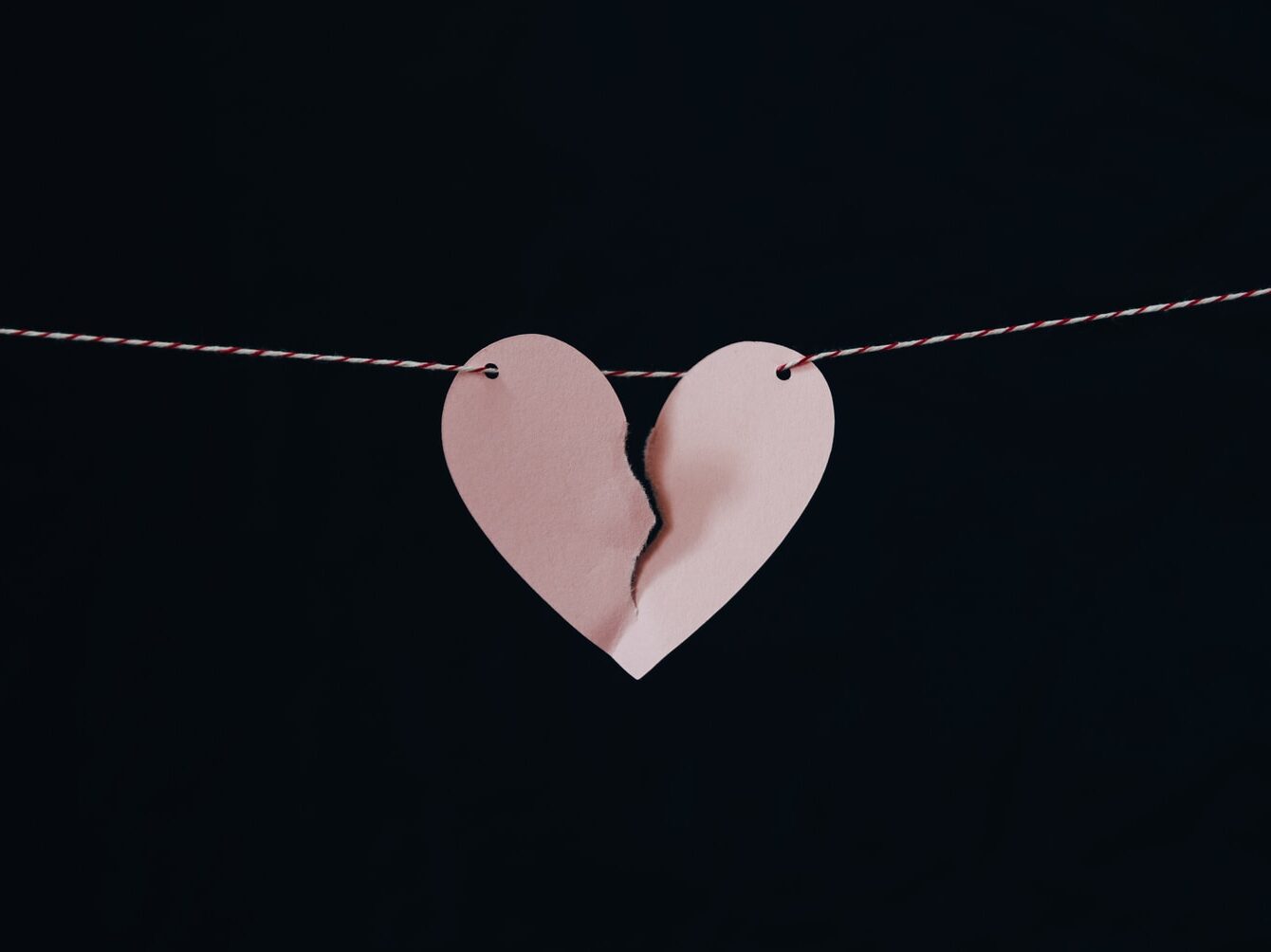 broken heart hanging on wire