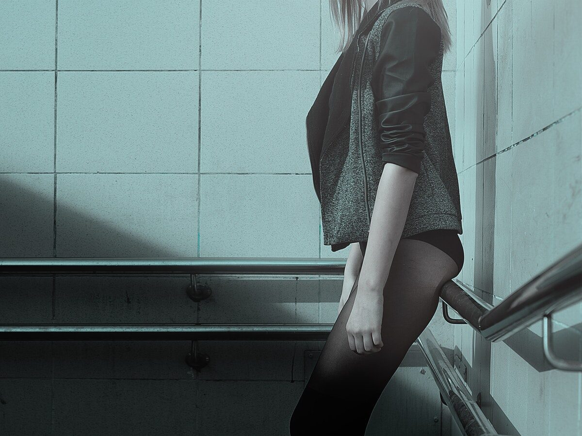 Woman Standing While Wearing Black Jacket