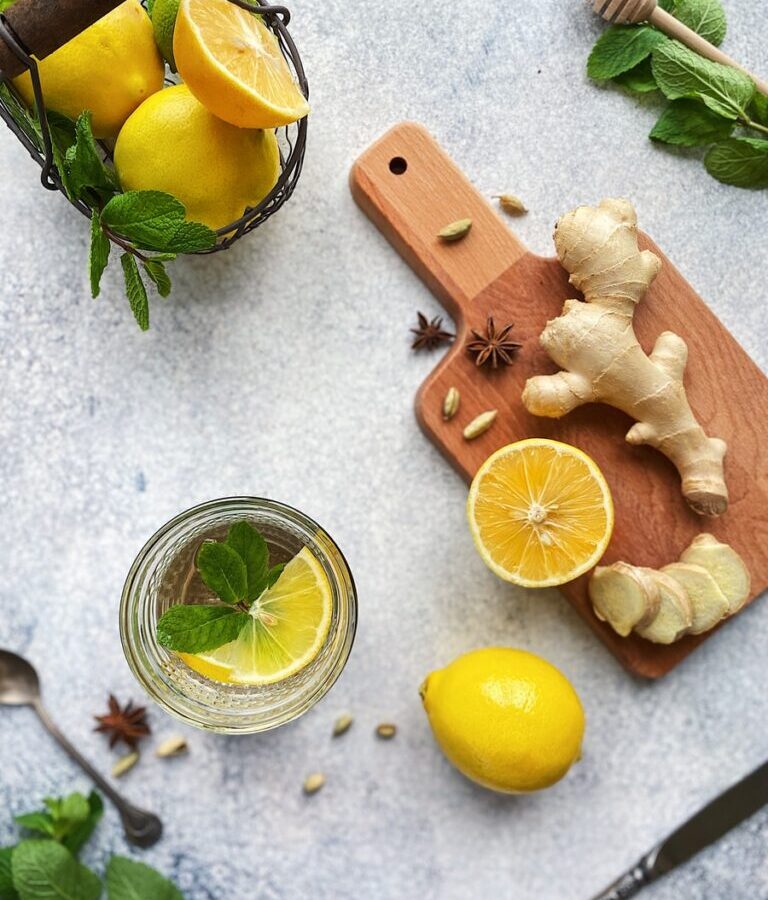 sliced lemon beside sliced lemon on chopping board