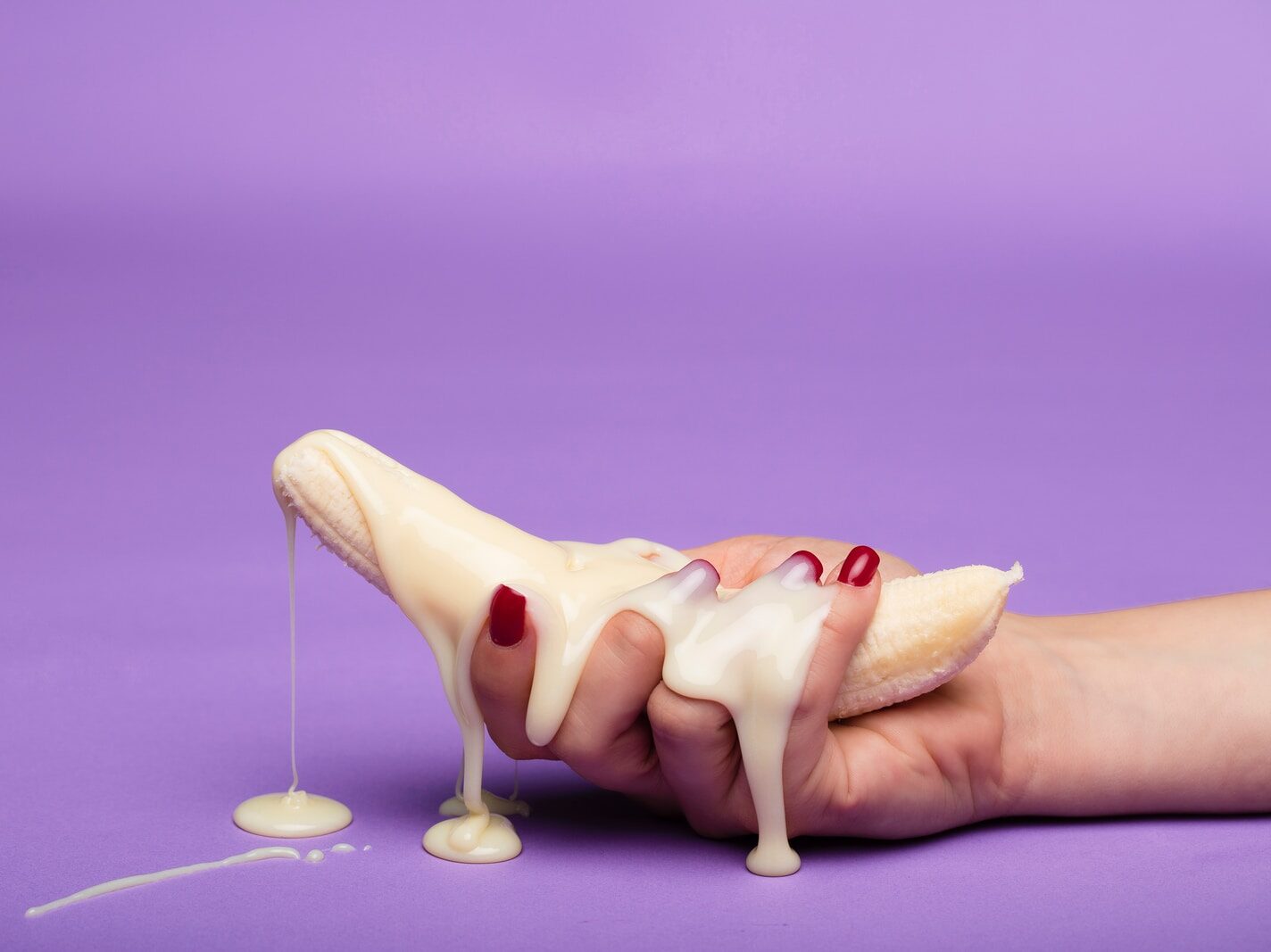 white ceramic figurine on purple surface