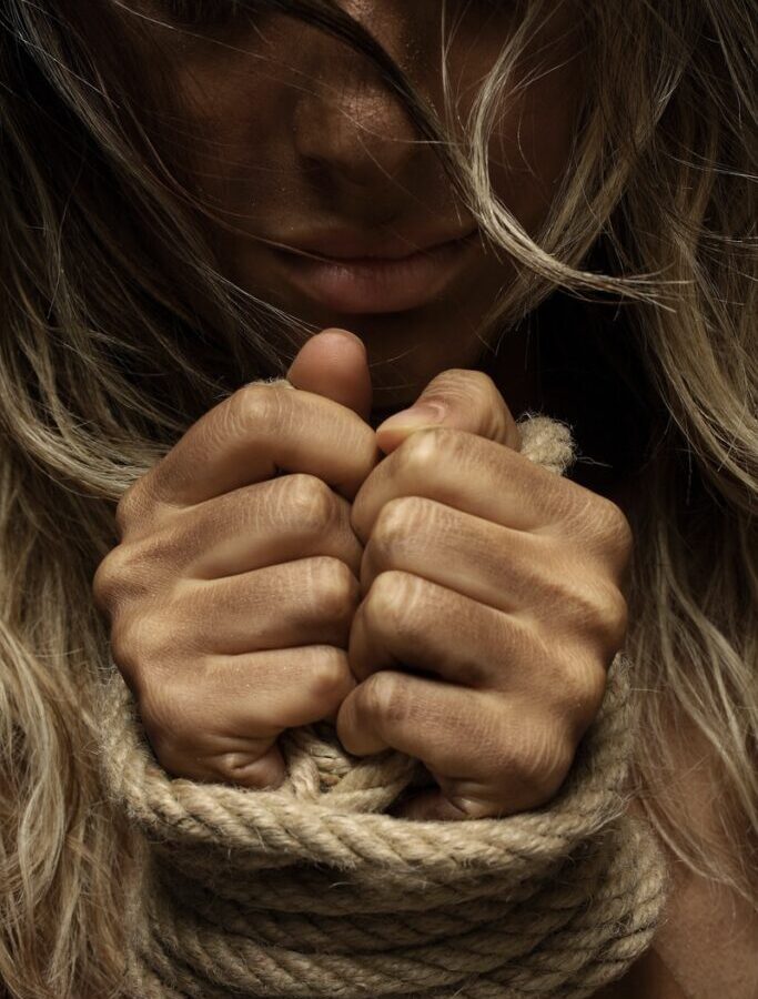 girl covering her face with her hand