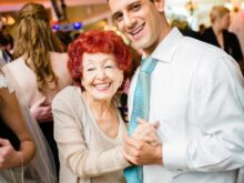 man and grandmother dancing