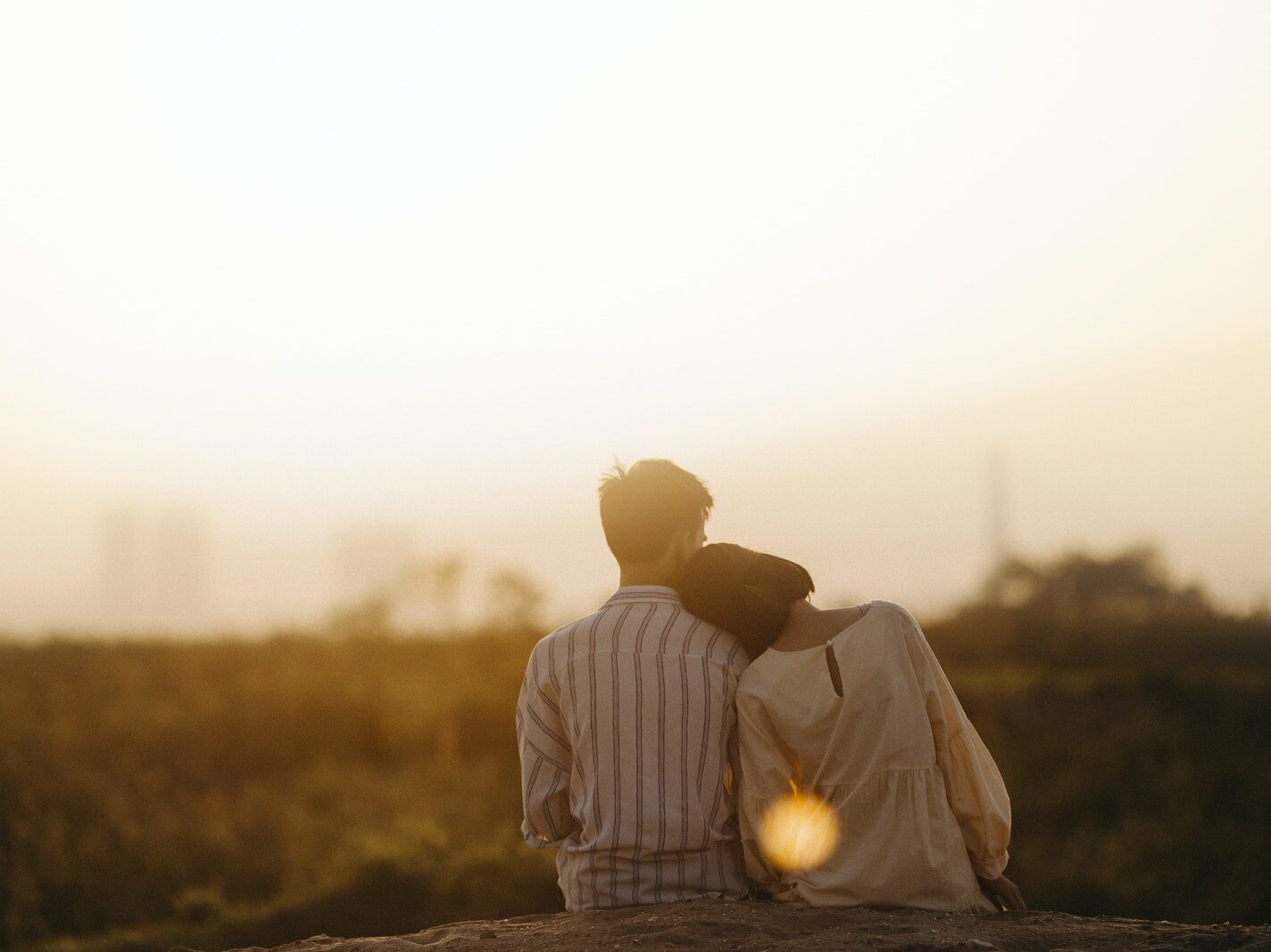Man and Woman Near Grass Field