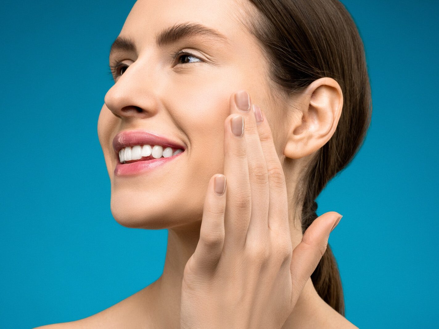 Woman Touching Her Cheeks