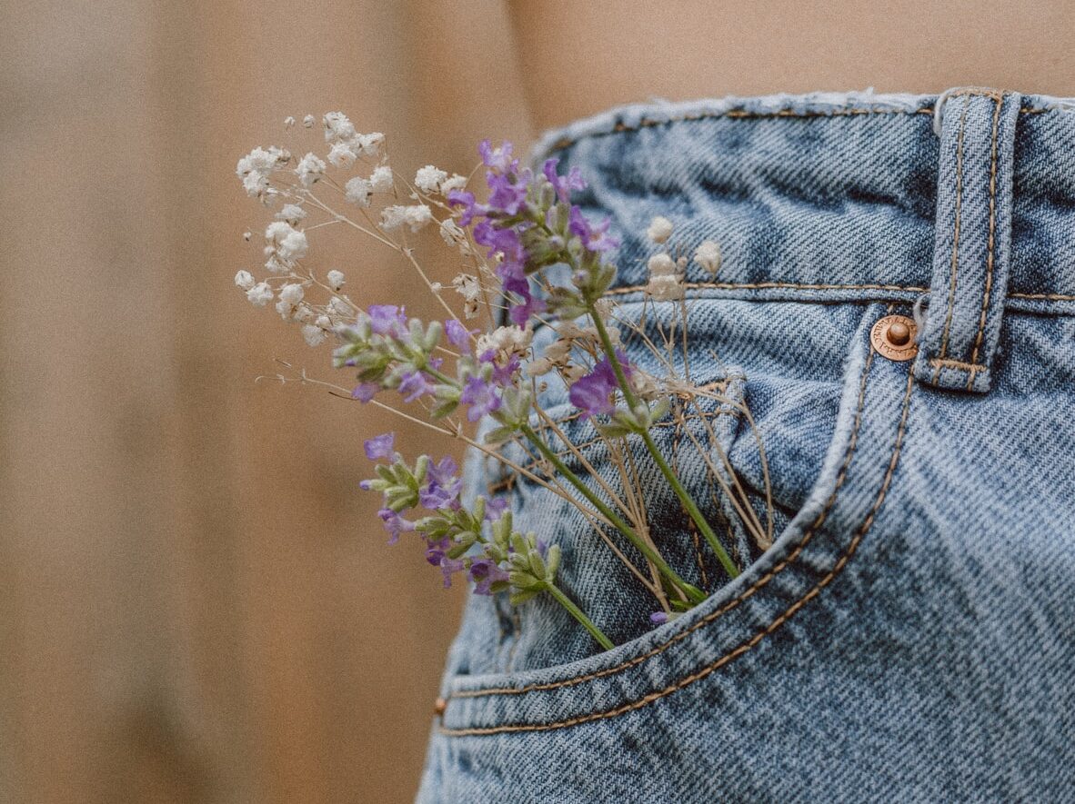 purple flower on blue denim shorts