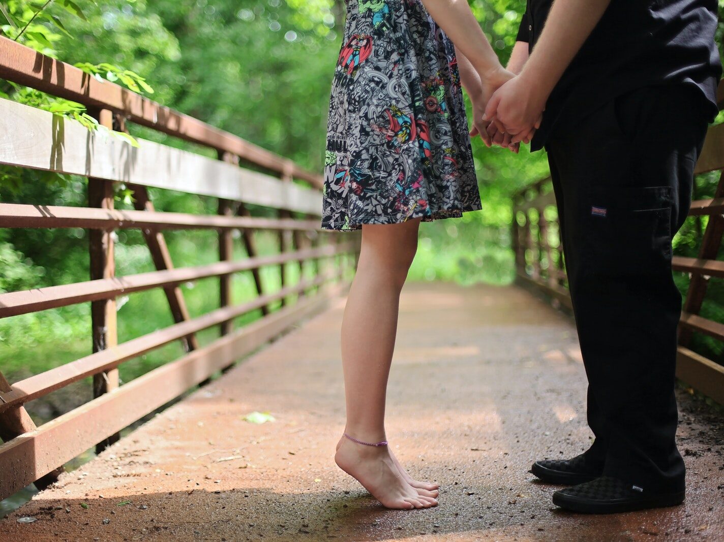Couple Standing on Bridge