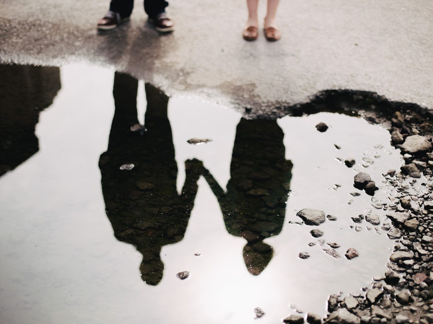 man and woman holding hand together