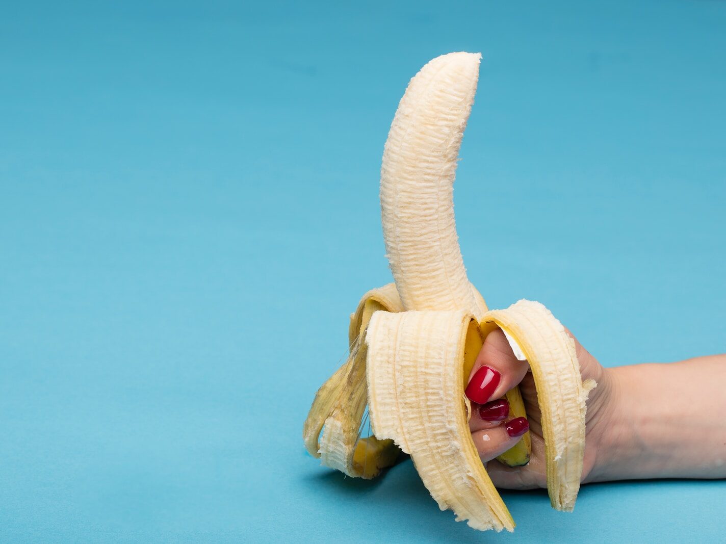 sliced banana fruit on blue surface