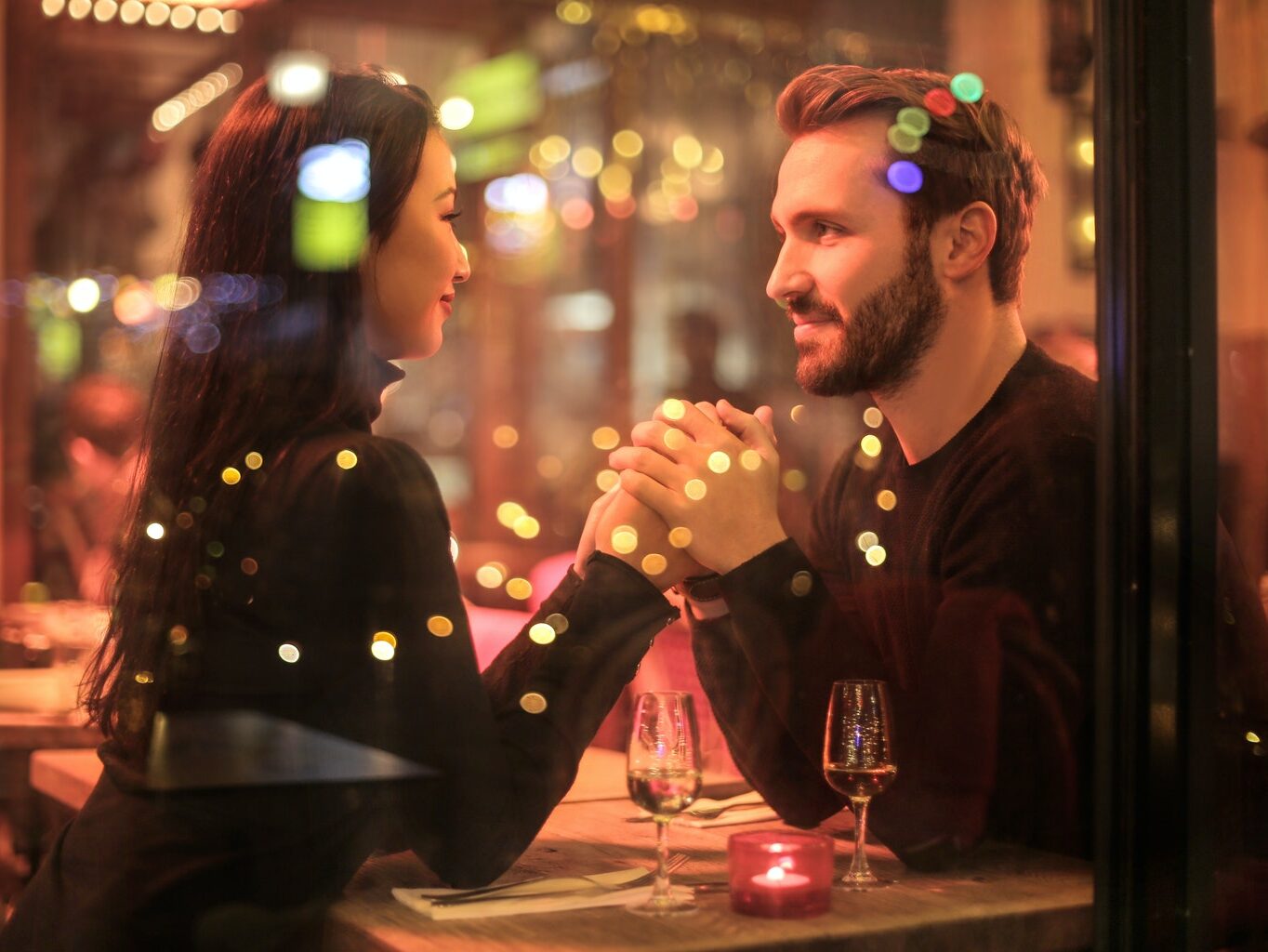 Photography of Couple Holding Hands