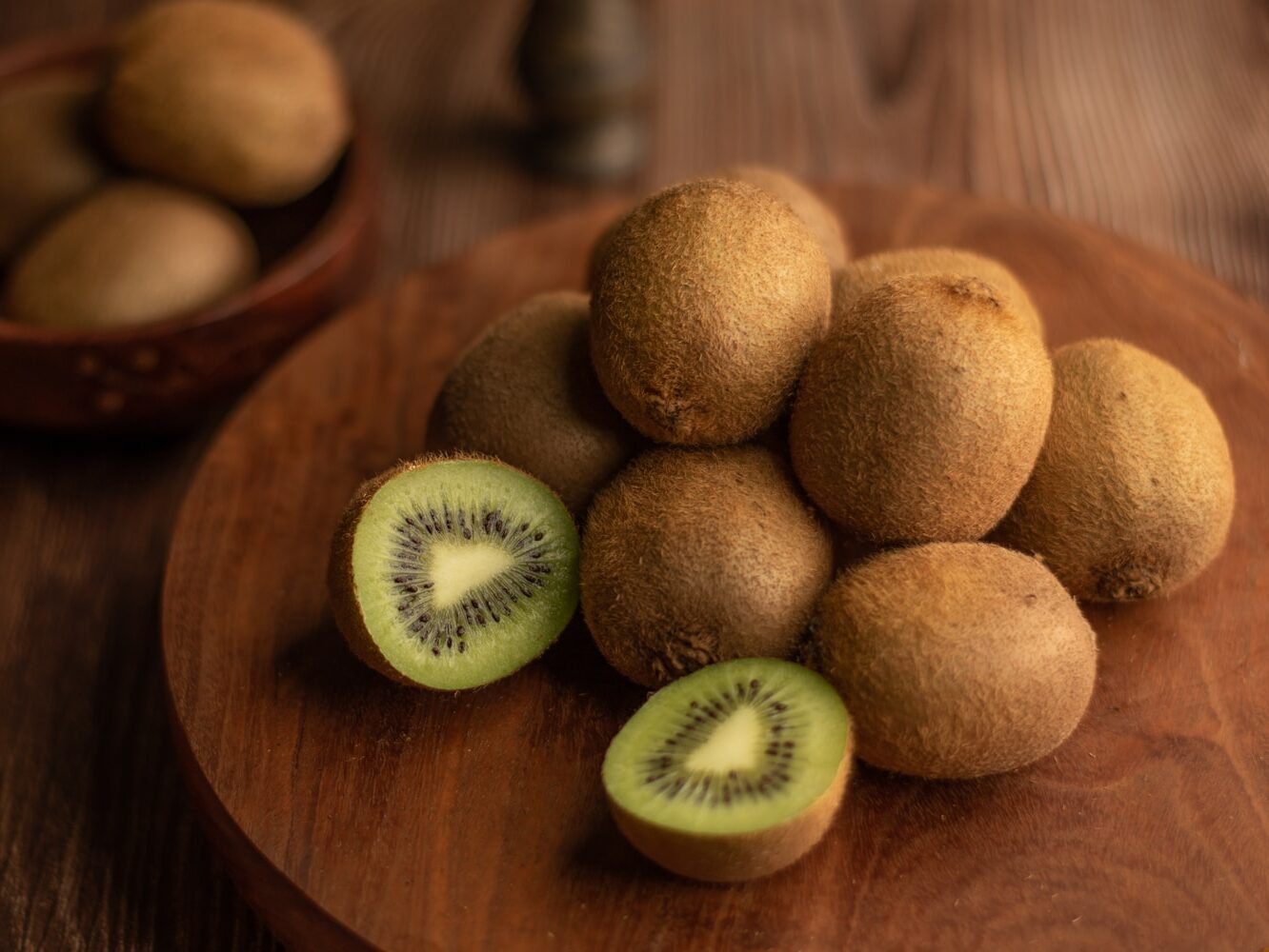 brown round fruit on brown wooden table