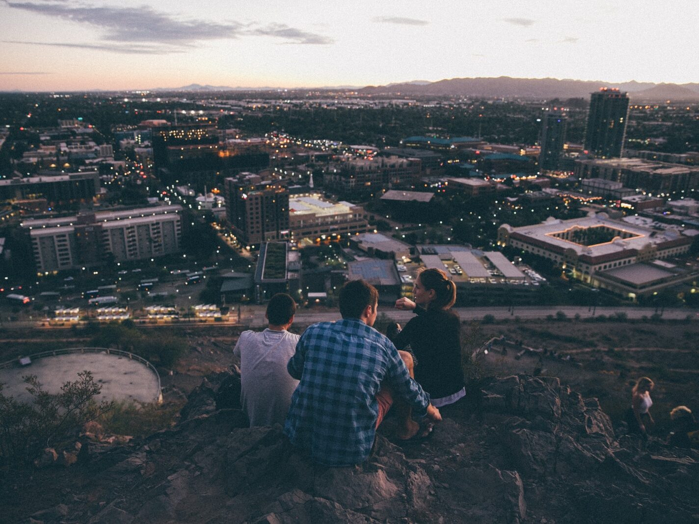 three person on cliff