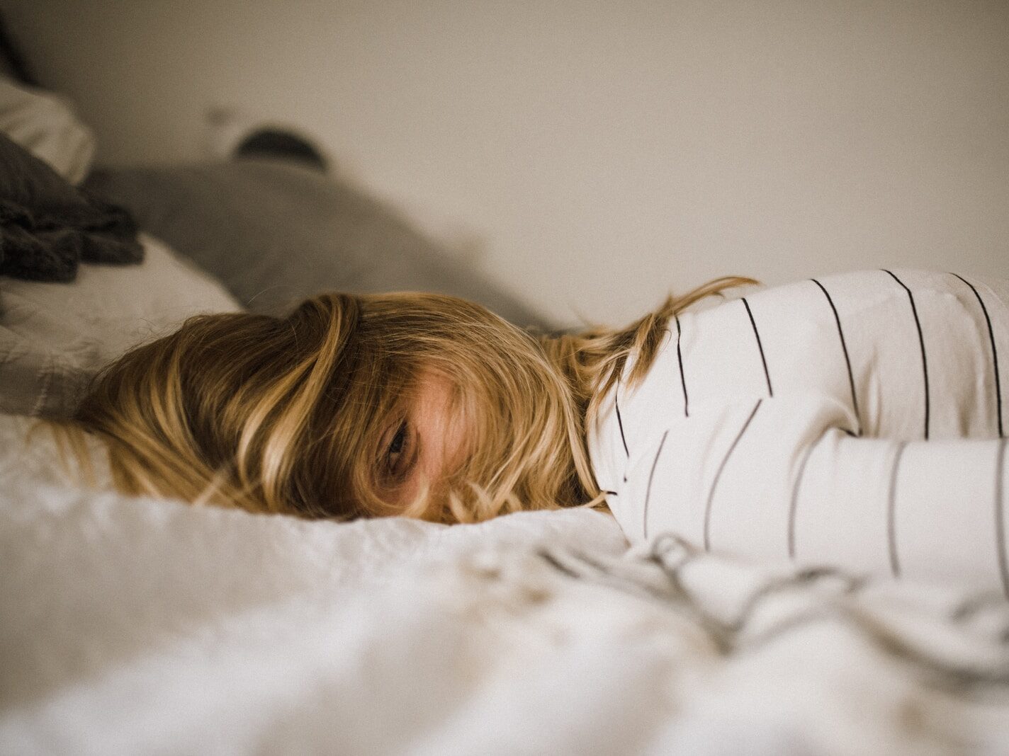 woman lying on bed