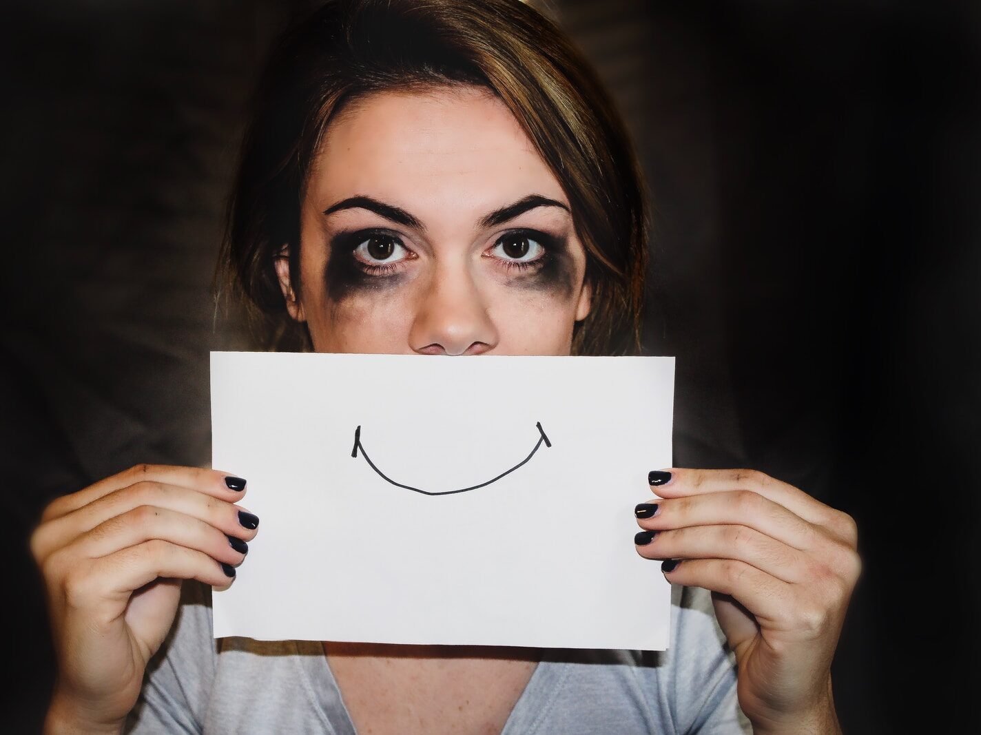 person holding white printer paper