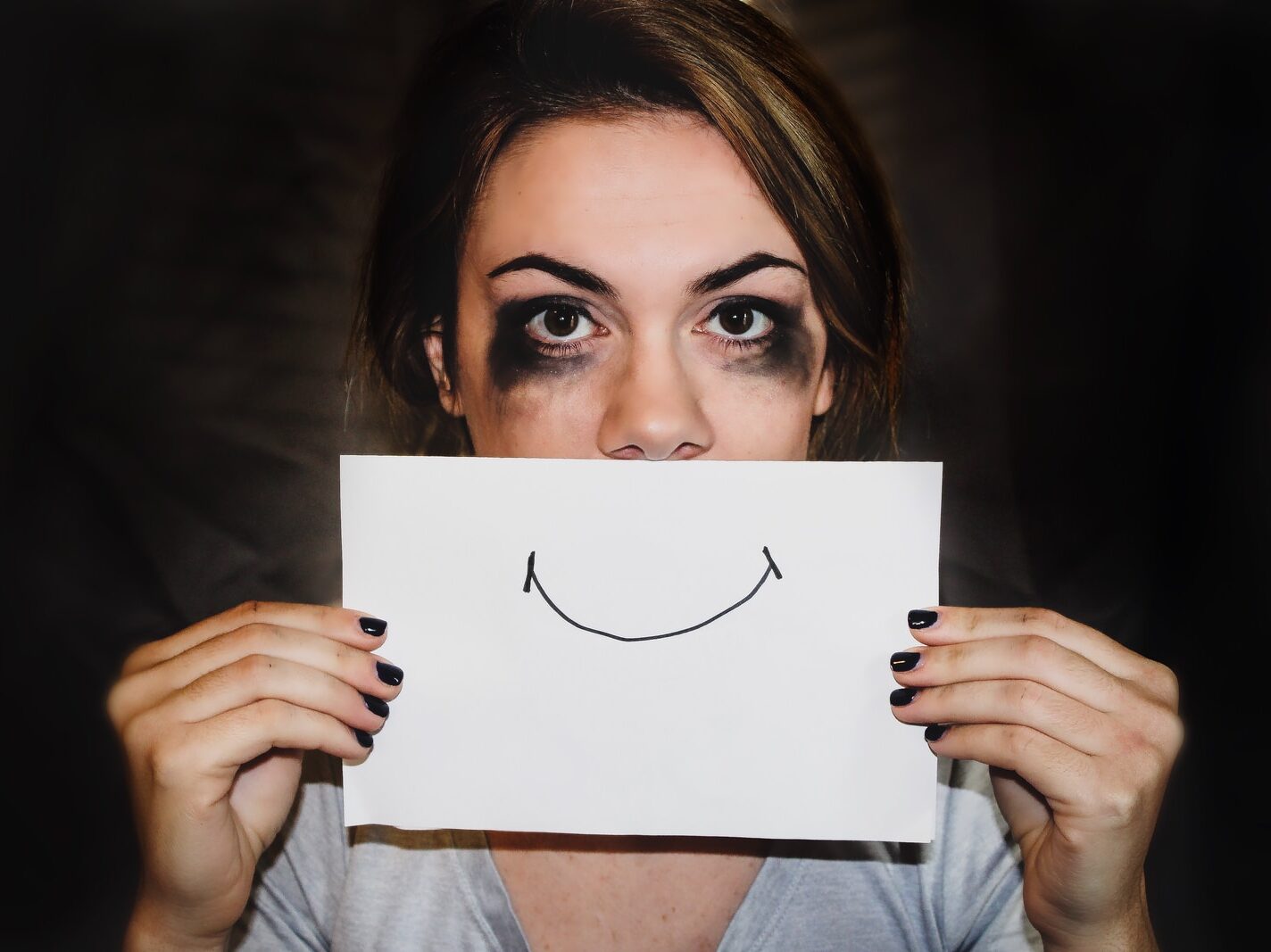 person holding white printer paper