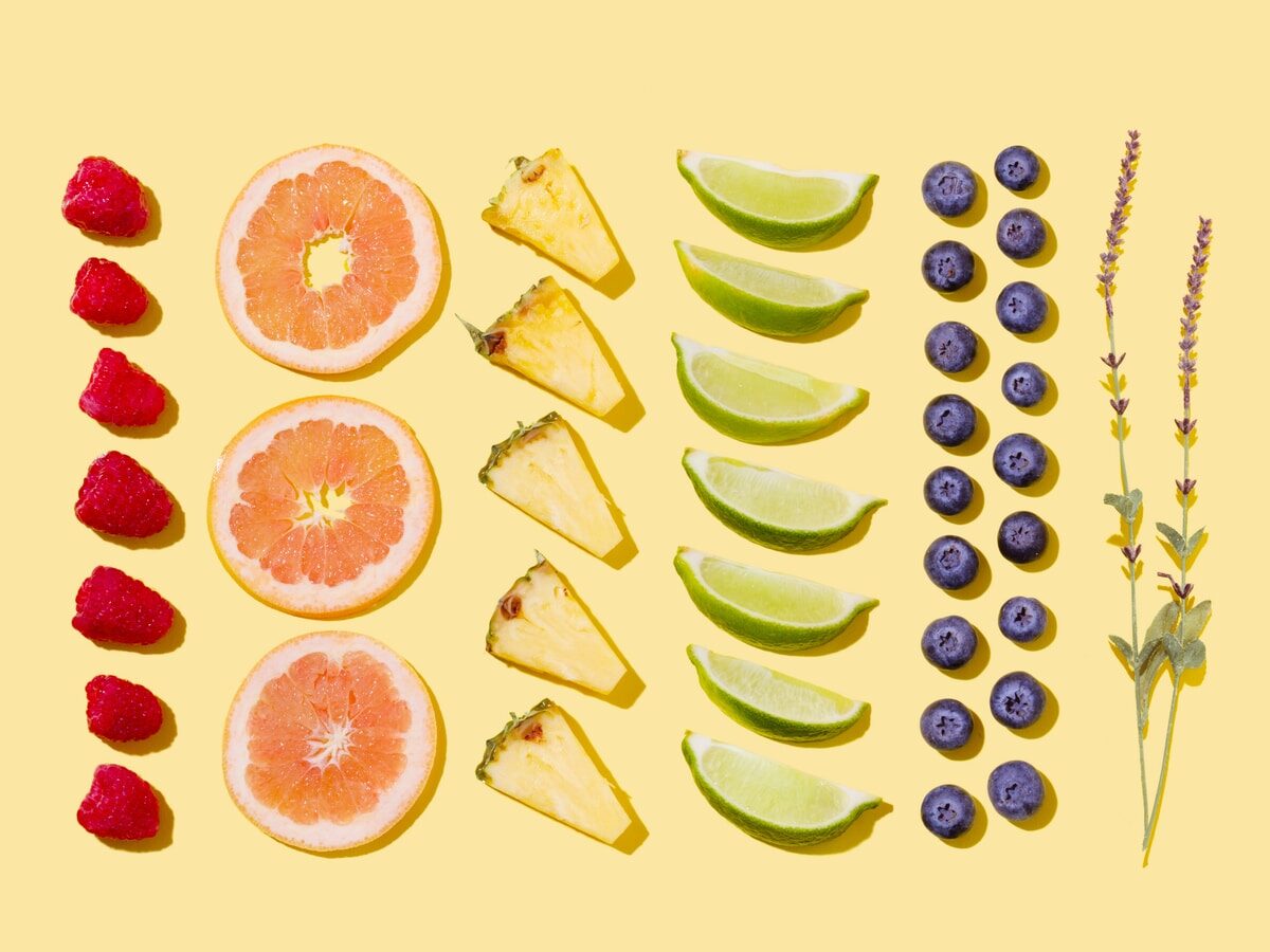 sliced fruits on white surface