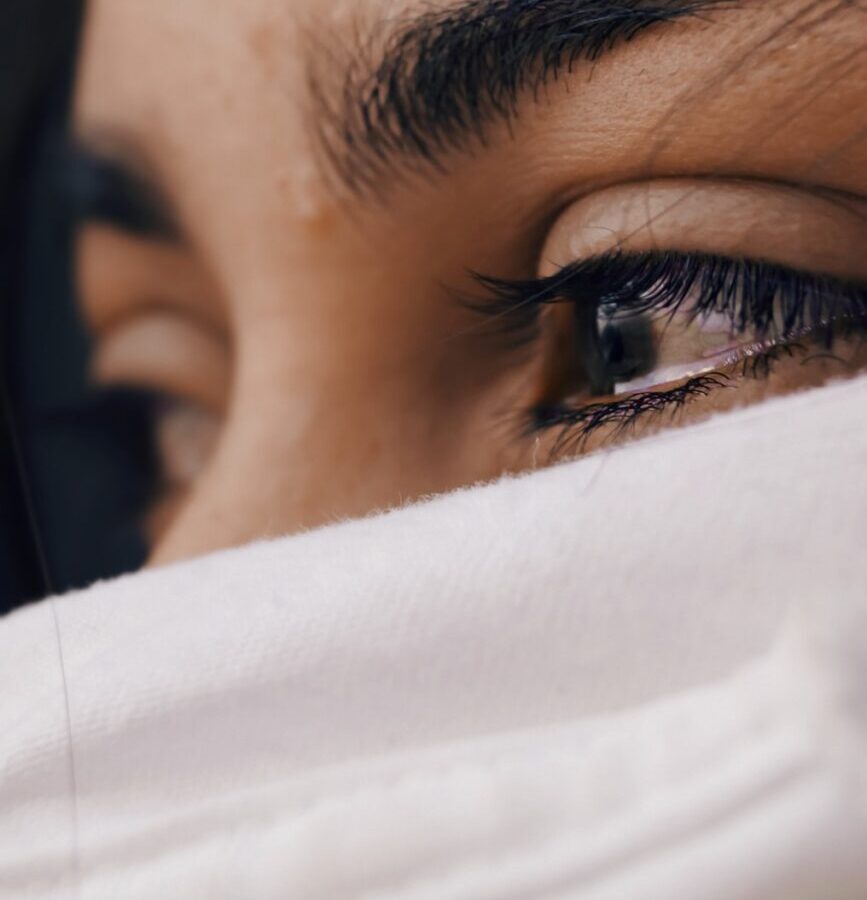 shallow focus of a woman's sad eyes