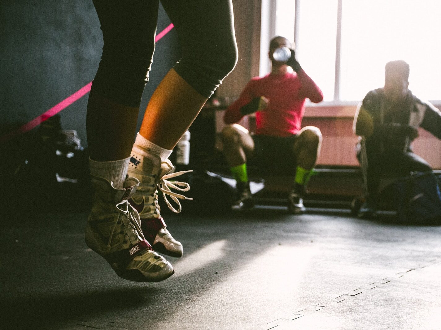 person wearing brown-and-white shoes jumping