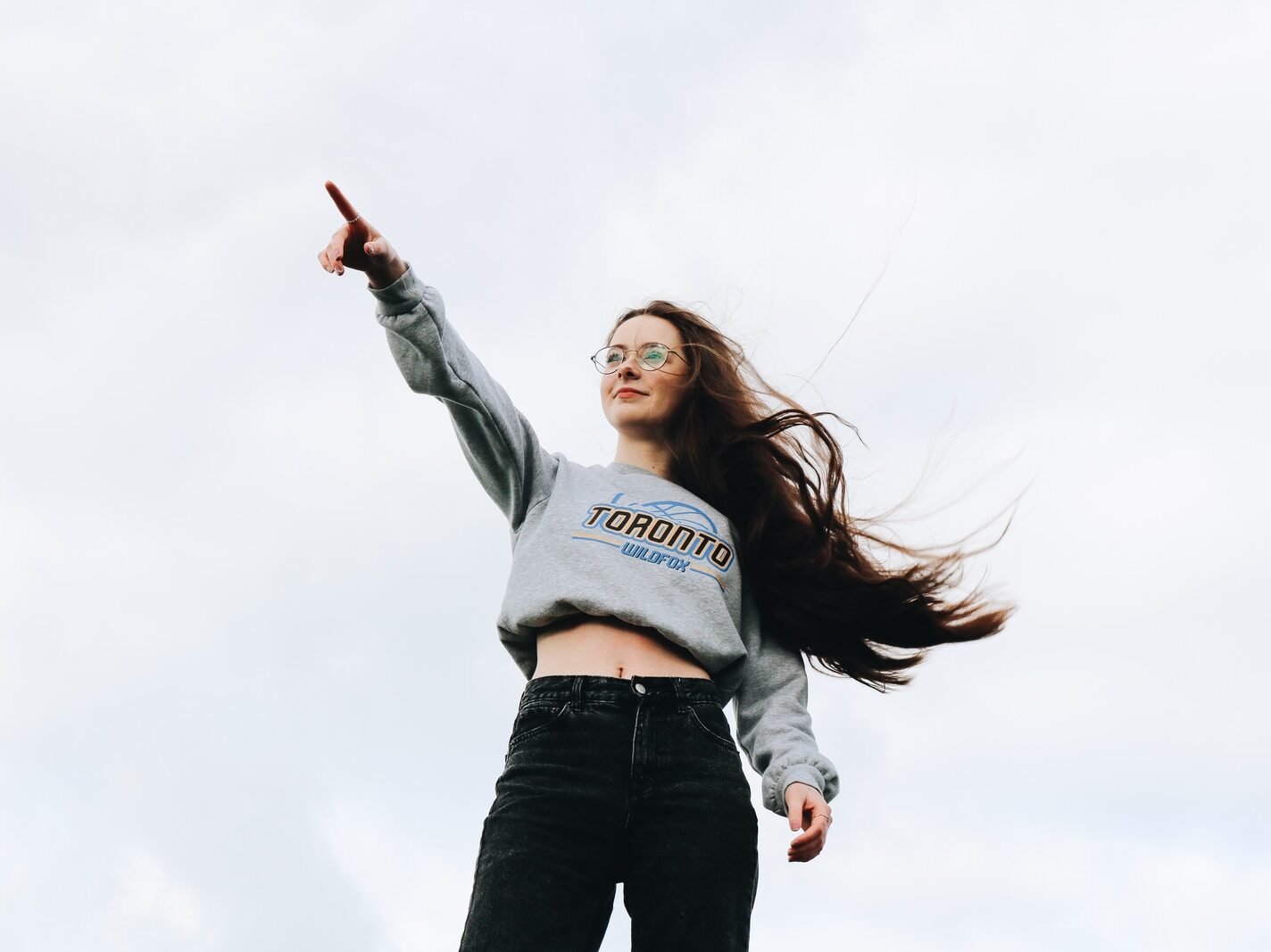 woman pointing using her right hand