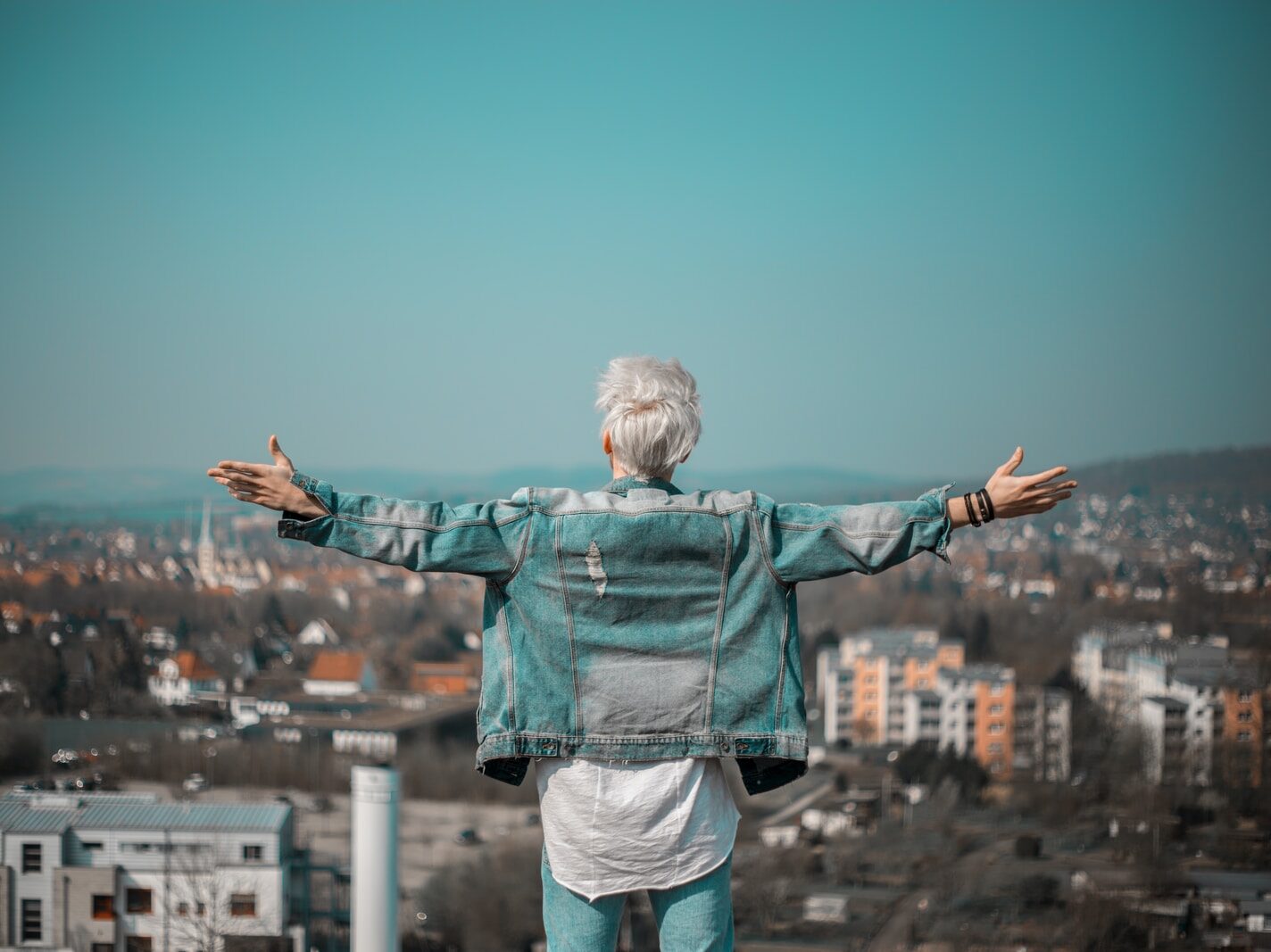 man raising hands on vignette photography