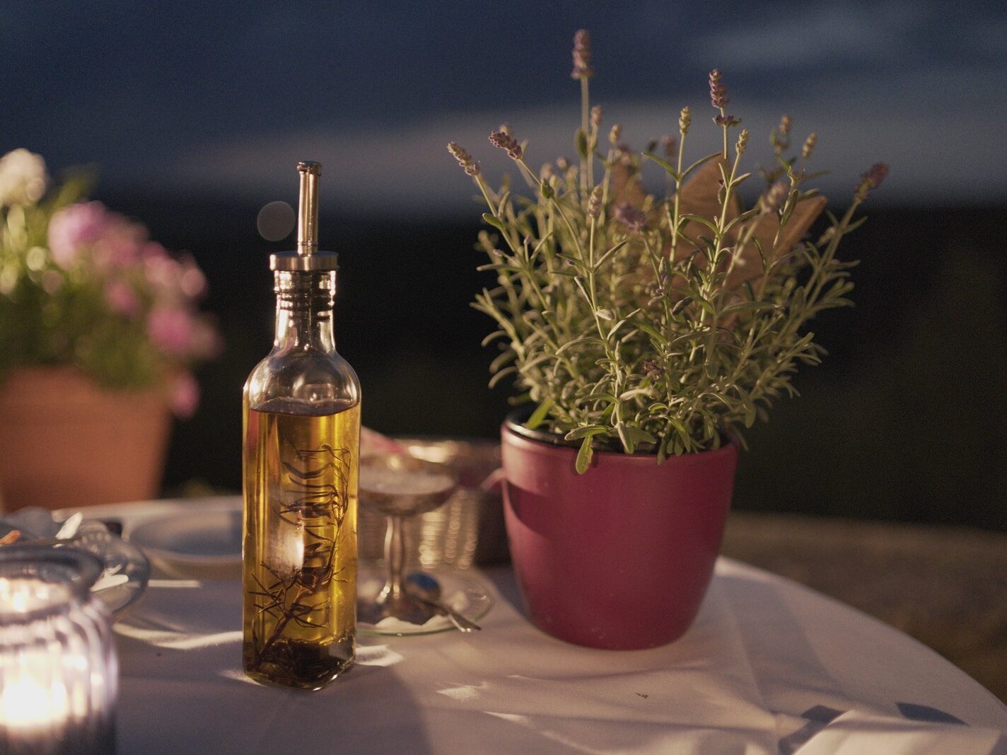 clear glass bottle beside plant