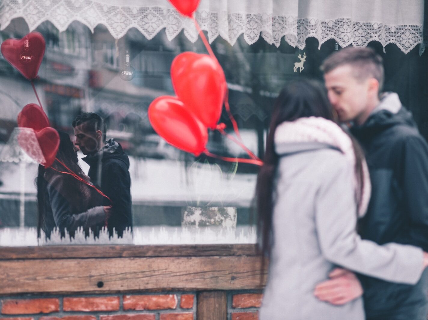 man and woman kissing