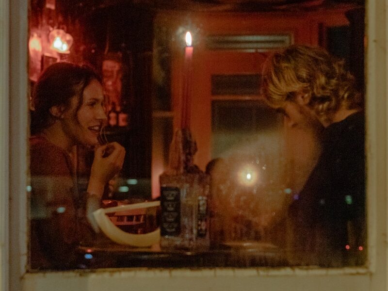 woman in black tank top beside woman in white tank top