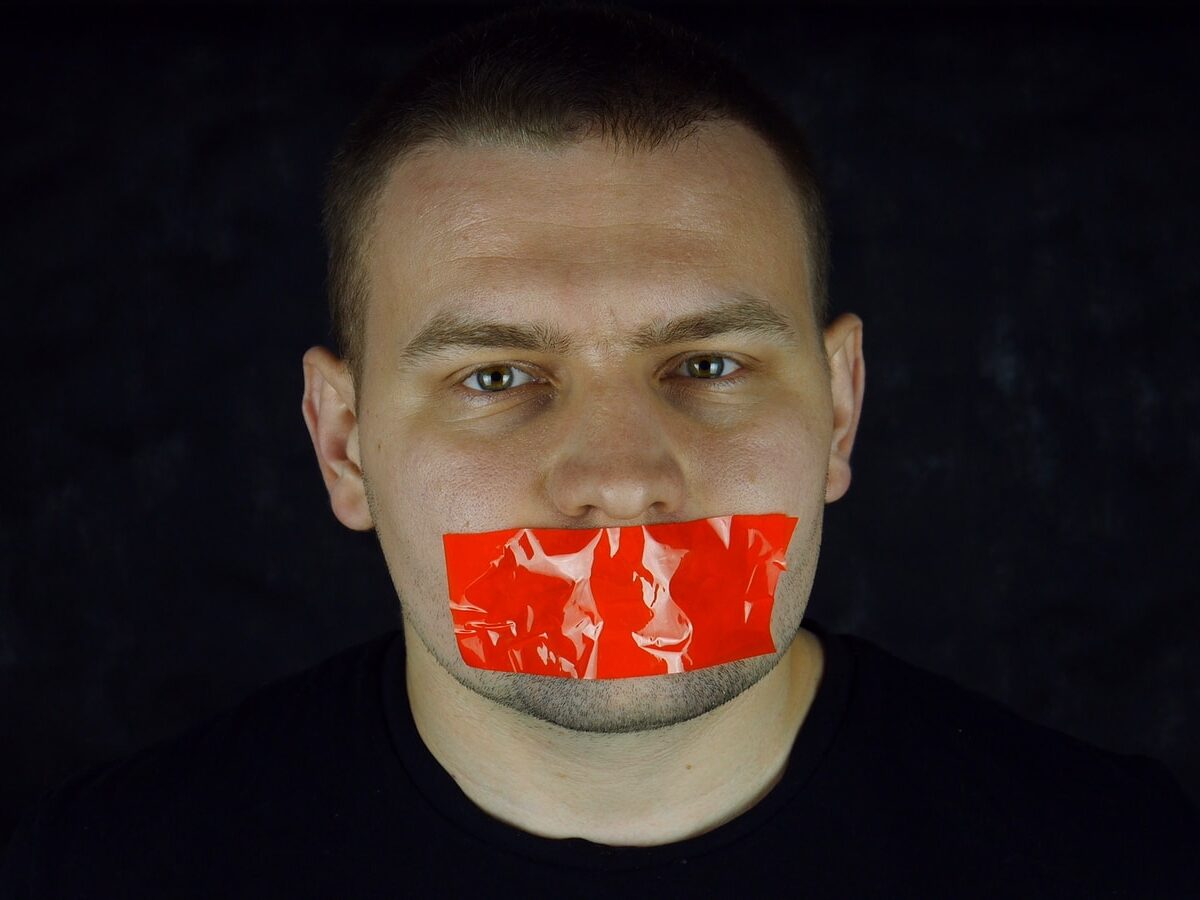 man in black crew neck shirt with red and white face paint
