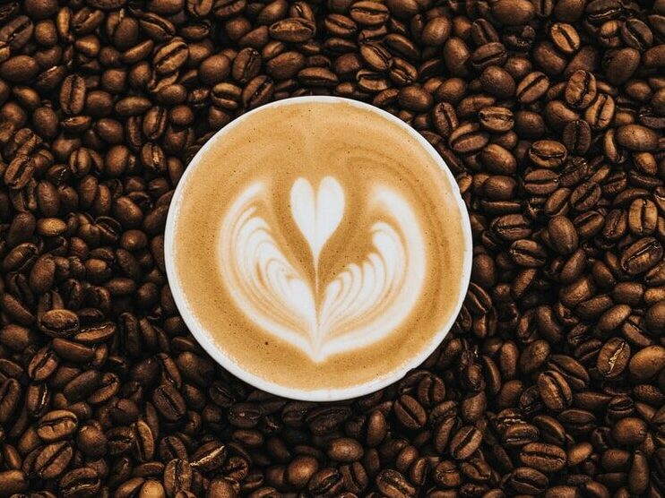 top view photography of heart latte coffee