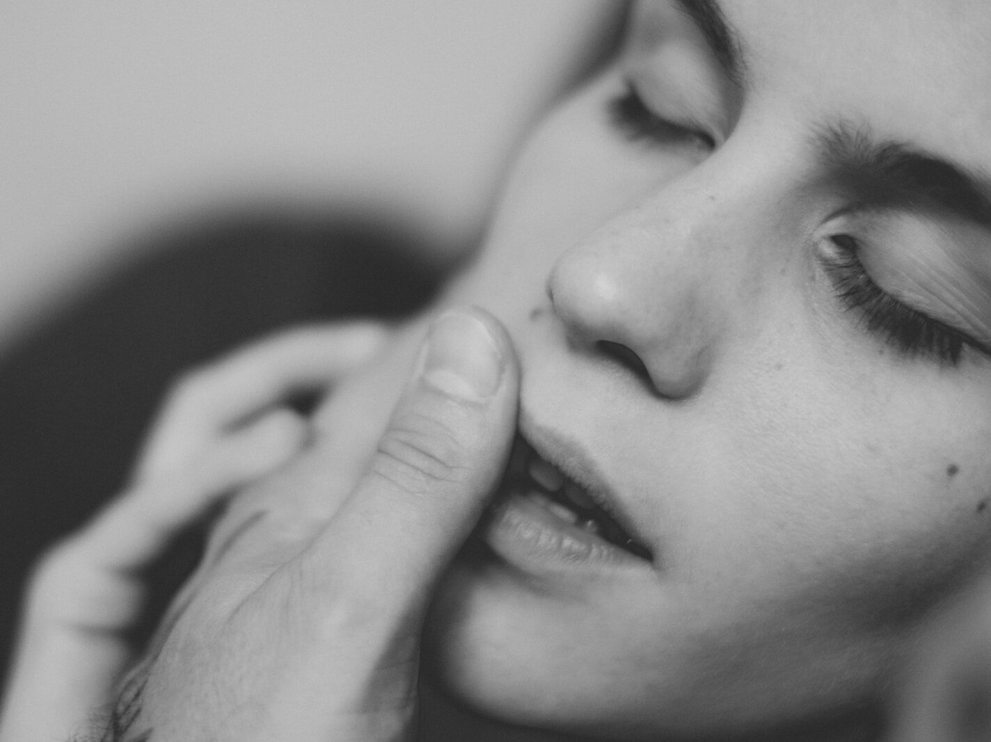 grayscale photo of womans face