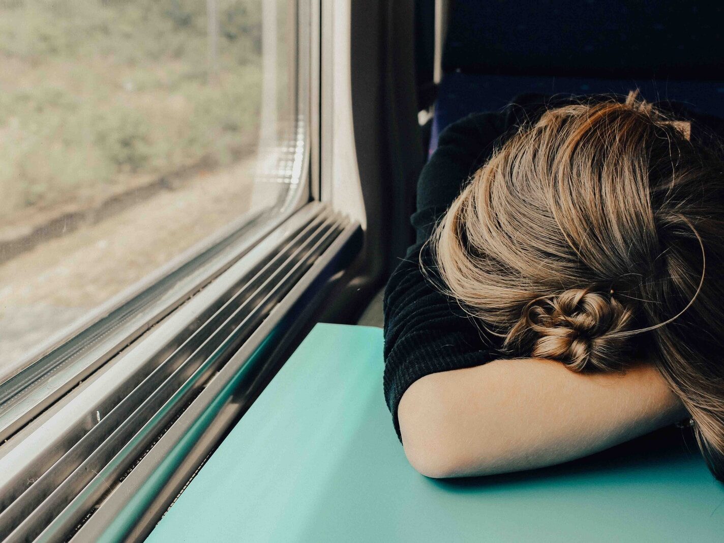 sleeping woman in train at daytime
