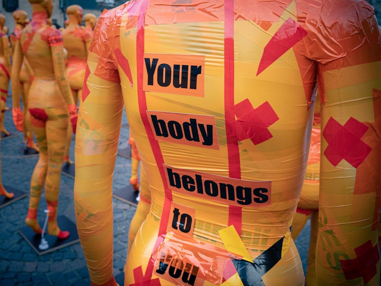 people in yellow and pink t-shirts