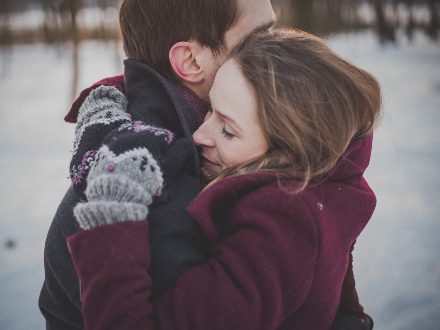 man and woman hugging each other