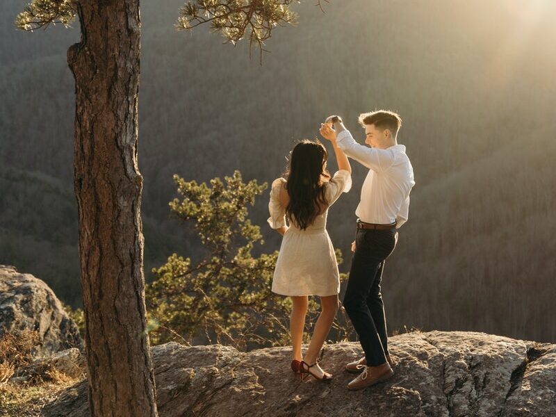 Couple Dancing on Mountain Top at Golden Hour 