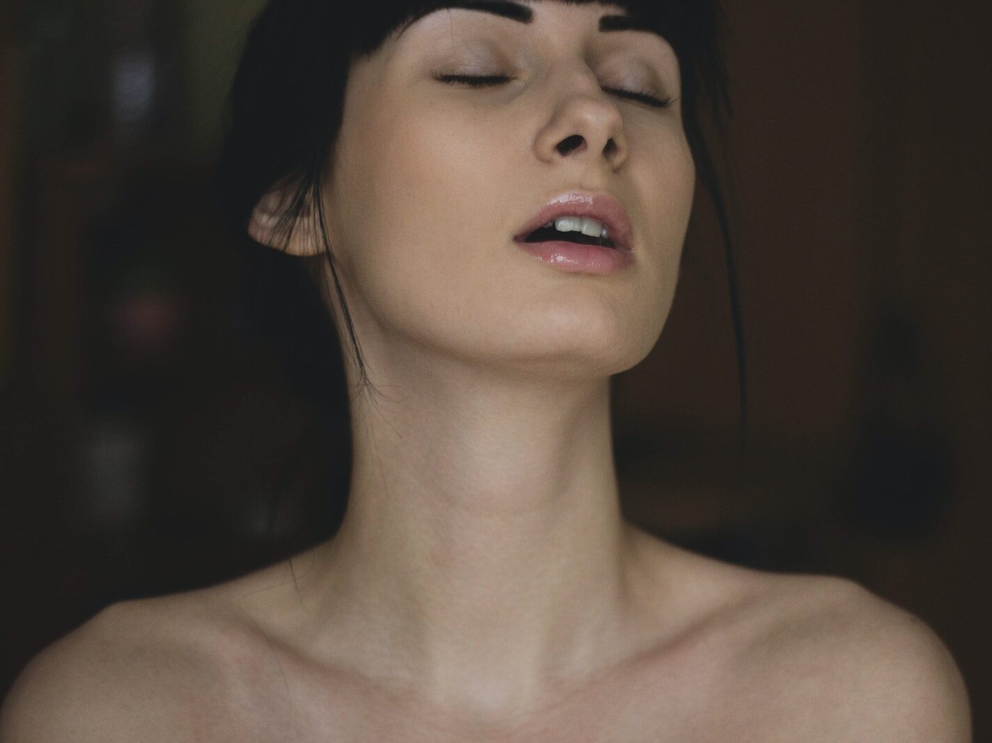 Topless Woman Closing Her Eyes