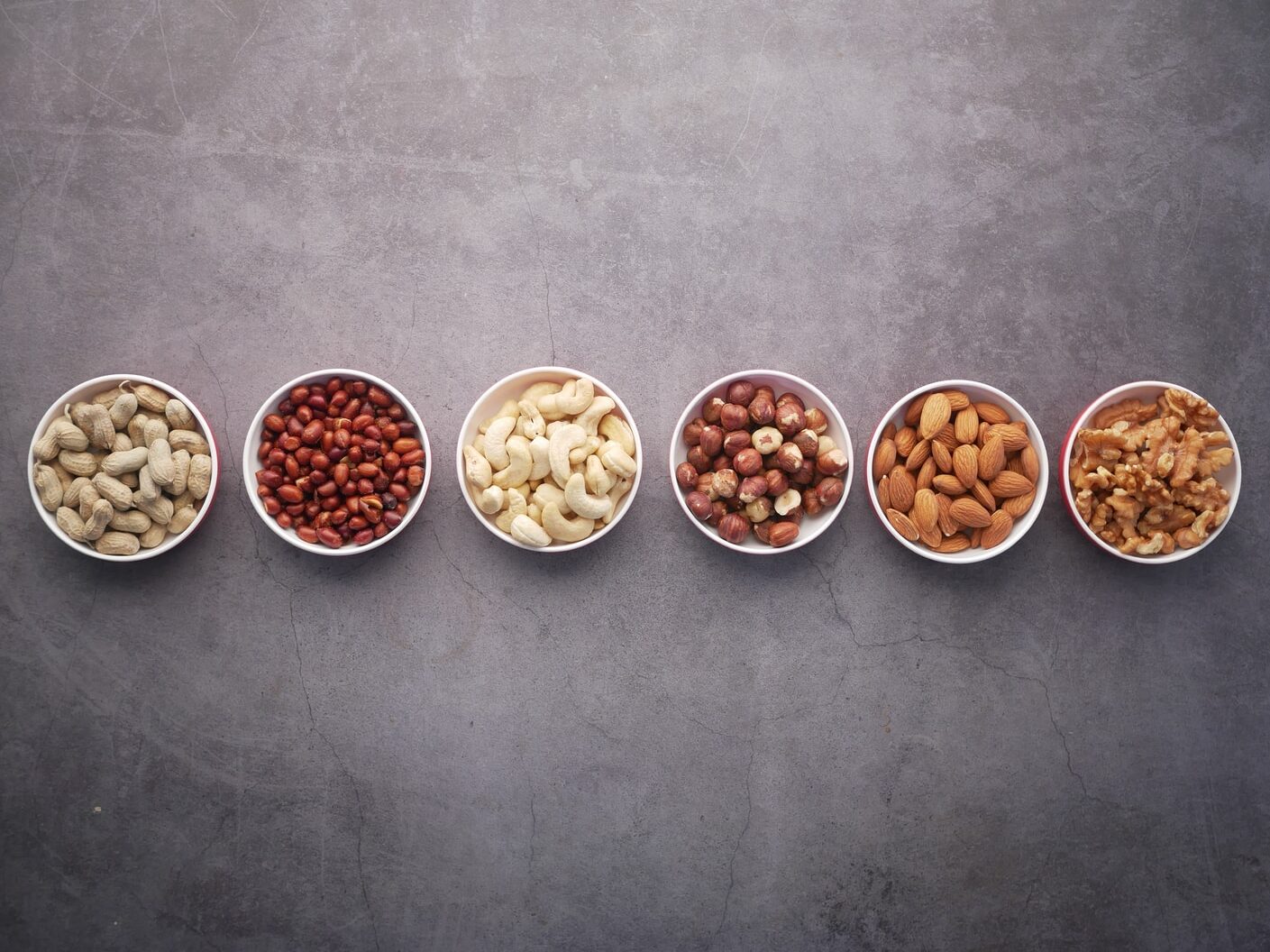 brown nuts on white ceramic bowls