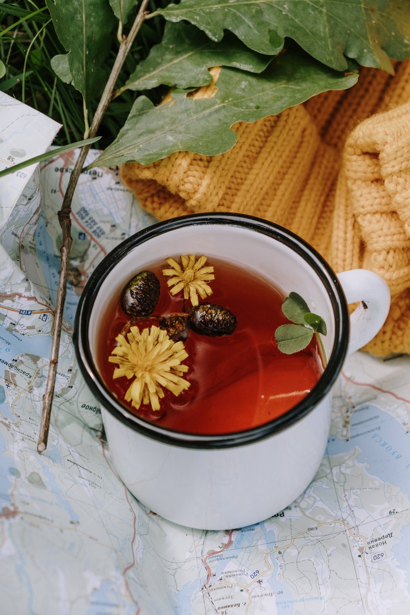 White and Red Ceramic Mug With Red Liquid Inside