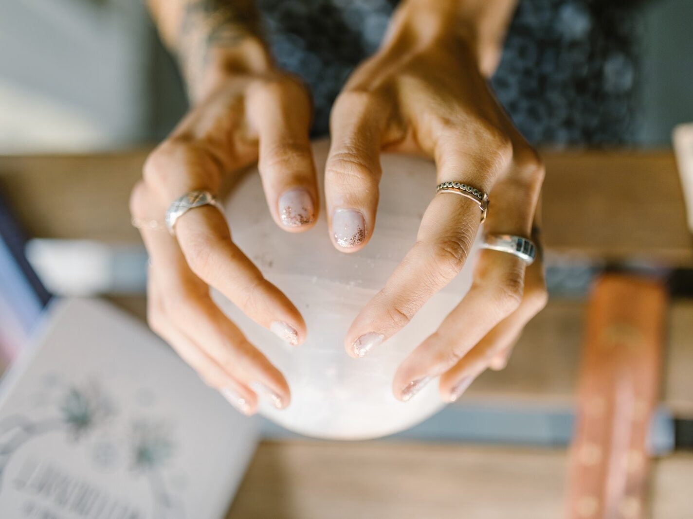 Person Wearing Silver Ring Holding White Ceramic Bowl