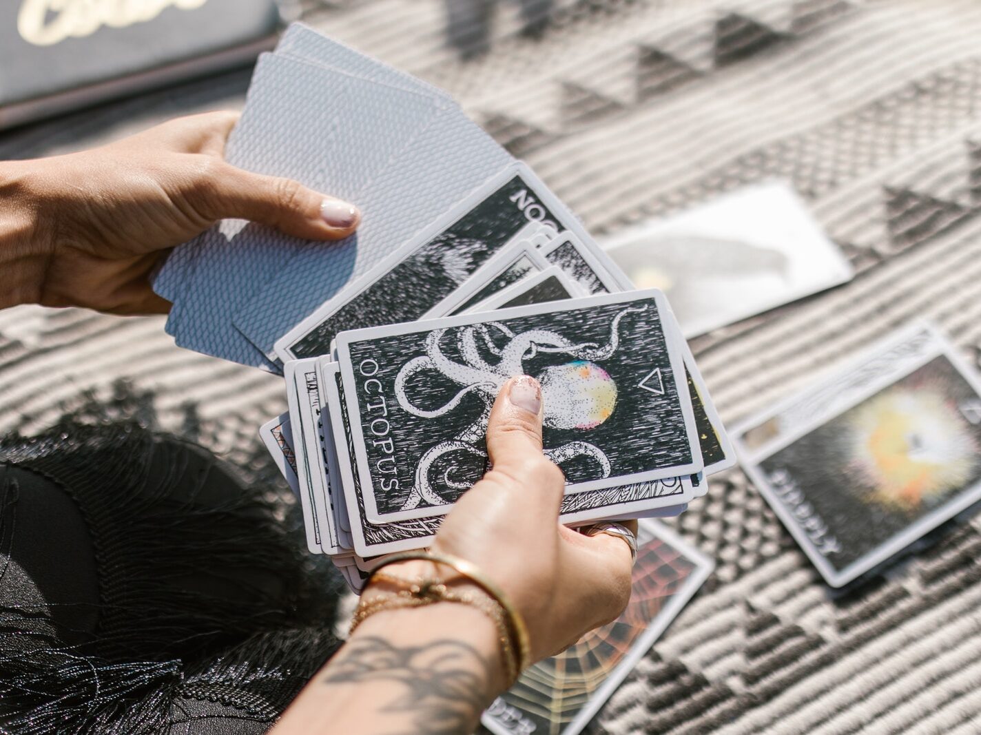 Person Holding White and Black Book
