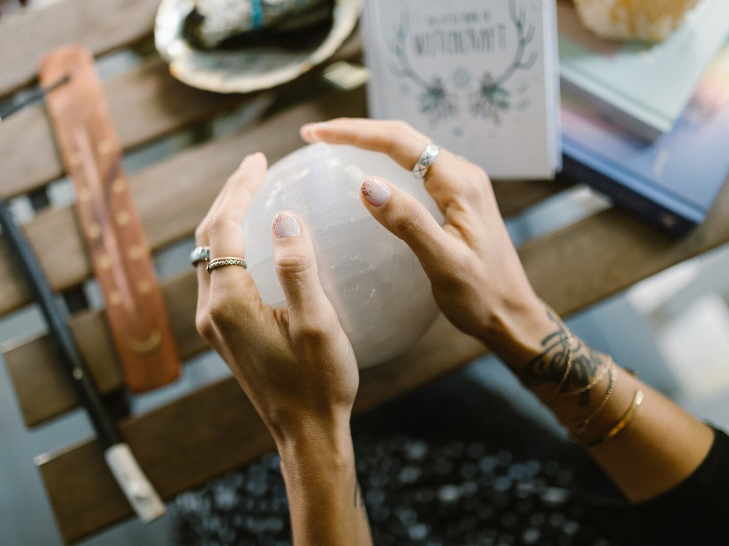 Person Holding Clear Glass Jar