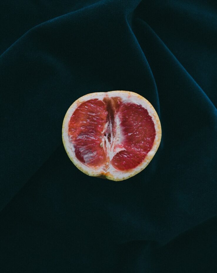 grapefruit on black surface