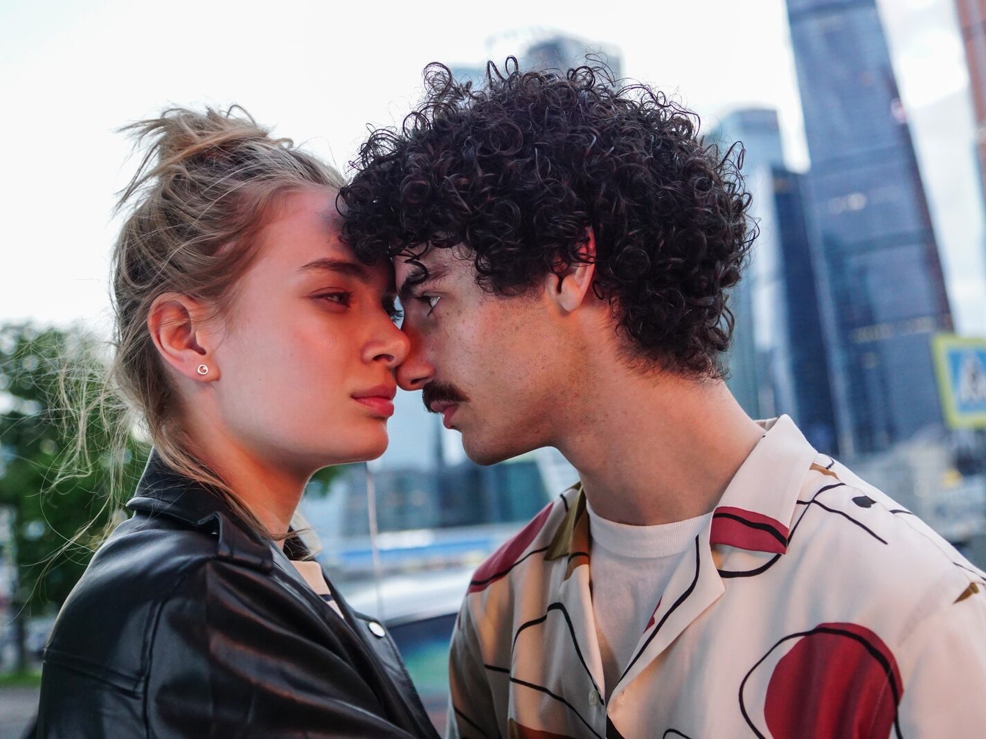 Man Leaning his Face on Woman's Face