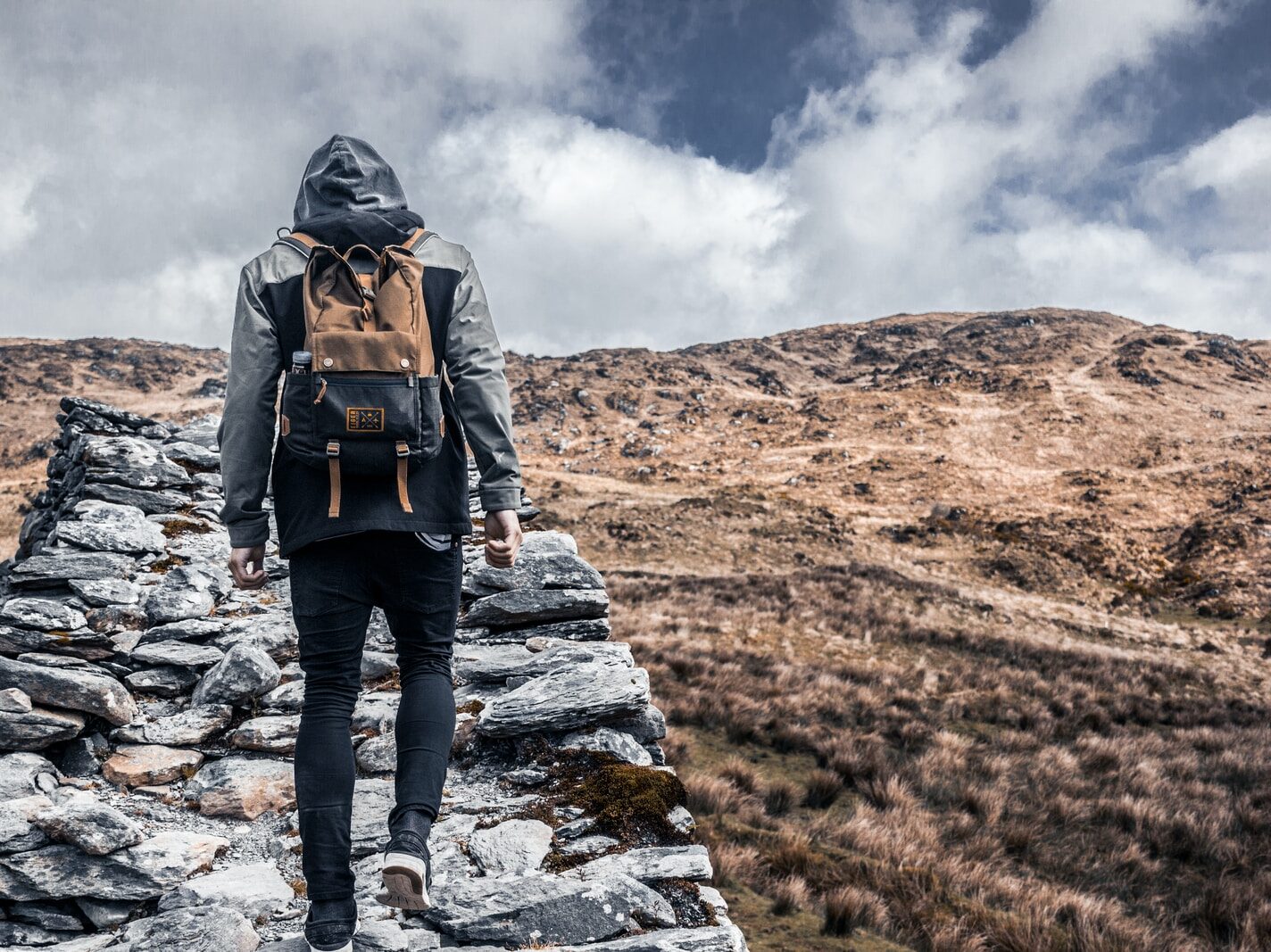 person standing on gray rock during daytime